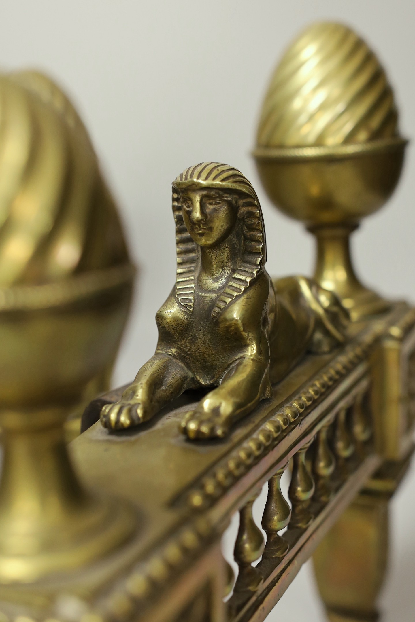 A pair of Egyptian revival bronze chenet, 27cm high